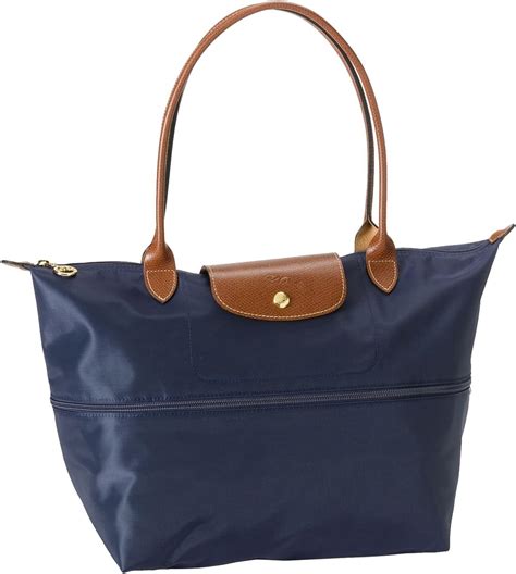 longchamp expandable tote with strap.